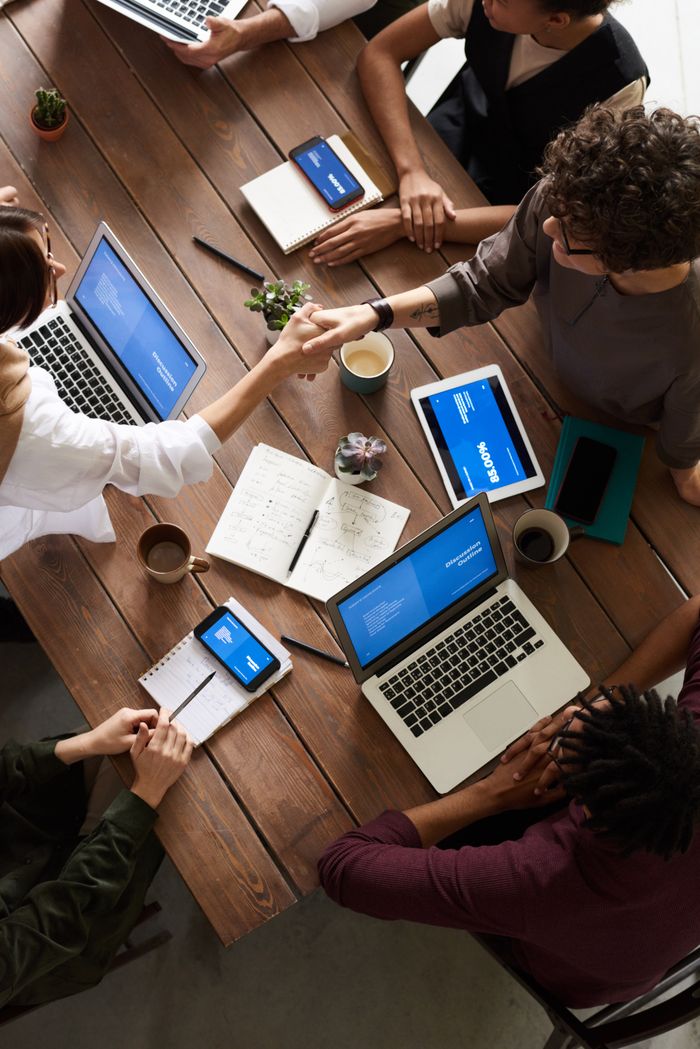 Mastering the First Impression: Your intriguing post title goes here A diverse group of professionals brainstorming in a modern workspace with laptops and notebooks.